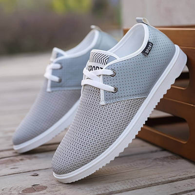 Chaussure homme légère et respirante, sneakers tendance en maille aérée avec semelle amortissante. Baskets confort pour sport, marche et style streetwear, disponibles en boutique chaussure et magasin de chaussures.